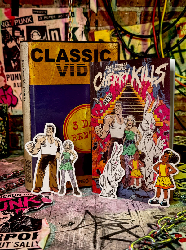 Cherry Kills Deluxe Kit box by Sean Thomas McDonnell, containing signed paperback, stickers, mixtape j-card, and numbered VHS rental case.