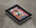 Tablet displaying a colorful comic book cover of "Cherry Kills" by Sean Thomas McDonnell on a gray surface