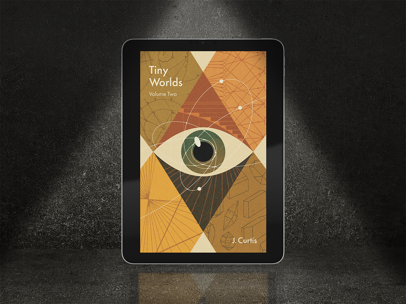 E-reader displaying Tiny Worlds Volume Two ebook cover with an eye design on a dark background