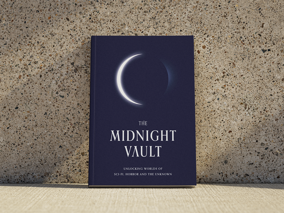 Paperback book titled 'The Midnight Vault' from Tiny Worlds Publishing with a crescent moon design on a textured surface.
